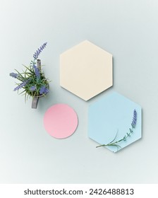 A pastel-toned light blue backdrop of hexagon and circle pedestal and flower, a view of the top, a decorative podium with a flat line. An empty platform for display cosmetic products, food and props