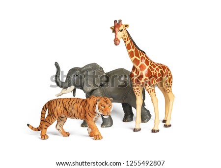 Pastic wild african animal toys isolated on white. Tiger, Elephant and giraffe. Children animal characters for playing zoo game