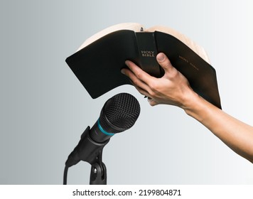 Pastor with a Bible in hand during a sermon. The preacher delivers a speech - Shutterstock ID 2199804871