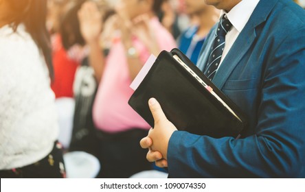 Pastor Holding A Bible Ready For Preach In Church.Christian, Preacher And Sunday Worship Concept.