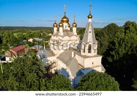 Pastoral landscape from above with a view of an old Russian Orthodox church in white. Spaso-Preobrazhensky Church of the 17th century. The village of Spas-Zagorie, Kaluga region, Russia