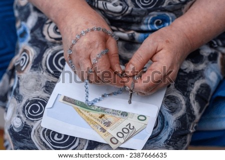 Pastoral visit by a priest after Christmas carols, an old lady holds a rosary and an envelope with money in her hand