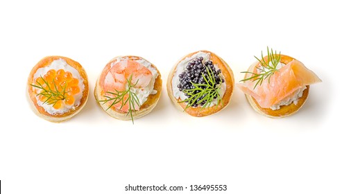 Pastries with salmon, caviar and shrimp