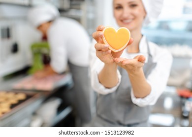 Pastry Chef Baking Heart Shaped Cookies Giving A Thumbs-up