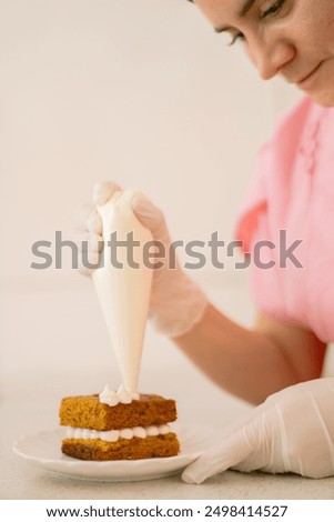 Similar – Image, Stock Photo Concentrated chef adding cream inside ceramic plate