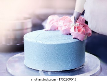 Pastry Chef Decorates The Cake, Chef With Confectionery Bag Squeezing Cream On Cake