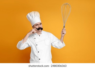 Pastry chef with fake mustache and big whisk on orange background - Powered by Shutterstock