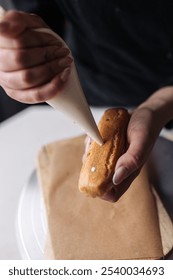 Pastry chef filled eclair with custard