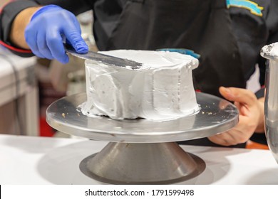 Pastry Chef Making Cake At Turntable