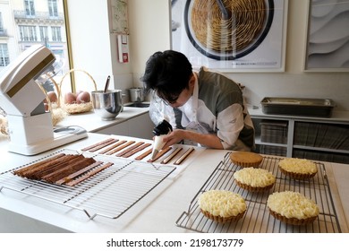 A Pastry Chef Prepares Traditional French Desserts In Cedric Grolet's Pastry Shop In Paris, France On April 23, 2022.