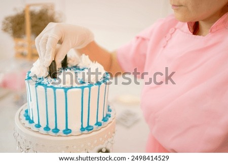 Similar – Image, Stock Photo Concentrated chef adding cream inside ceramic plate