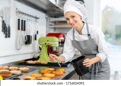 Pastry Chef Woman Glazing Little Cakes
