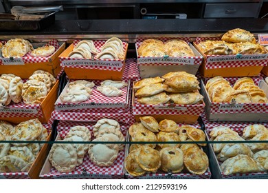 Pastry products on the market stall. Different semi healthy pastries.  Tasty looking baked goods sold on the market. Morning stall full of freshly cooked pastry products