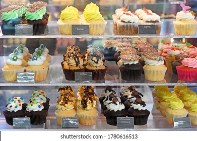 Pastry Shop Display Window Of Delicatessen Bakery Store With Variety Of Cupcakes.