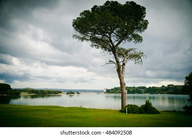 Pasture and barn from National Park Brijuni, in Croatia. tree on the shore of the lake. Fall Misty Morning on the River. Mainly cloudy - Powered by Shutterstock