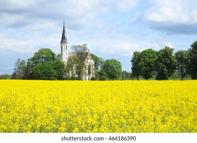 A pasture view with white church in opolskie county near Nysa, Poland