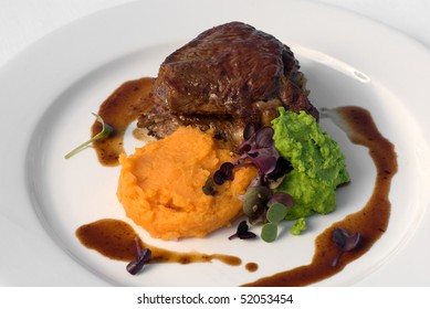 Pasture-fed Sirloin Steak, With Sweet Potato Mash, Pea Puree, And A Red Wine Jus