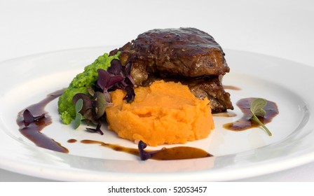 Pasture-fed Sirloin Steak, With Sweet Potato Mash, Pea Puree, And A Red Wine Jus