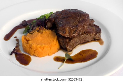 Pasture-fed Sirloin Steak, With Sweet Potato Mash, Pea Puree, And A Red Wine Jus