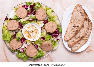 Pasty Disks On Salad, With White Sauce And Toasted Bread