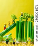 Pasuruan INA - Aug 20, 2024: Lego builders constructing a bridge from celery stalks.