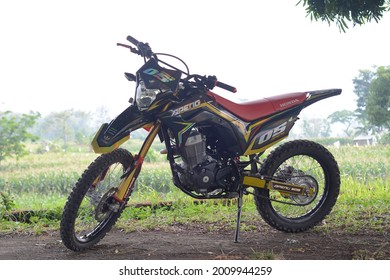 Pasuruan, Indonesia - July 15, 2021: Honda Dirt Bike . Side View Of Honda Motocross Or Honda Dirt Bike With Nature Background. Extreme Moto Sport