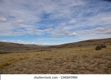 Patagonian Desert Landscape With Blue Sky And White Clouds