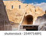 Patara ancient city parliament building stage at sunset.