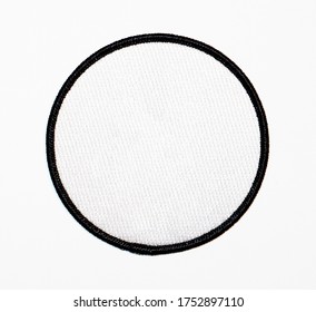 Patch, blank, circle. White with black trim.