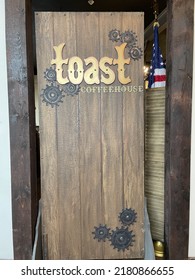 Patchogue, NY, USA, 7.17.22 - The Wooden Entrance To The Restaurant Toast.