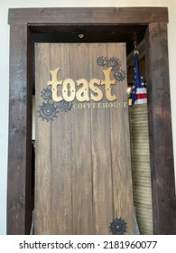 Patchogue, NY, USA, 7.17.22 - The Wooden Entrance To The Restaurant Toast.