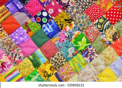 Patchwork quilt. Part of patchwork quilt as background. Flower print. Color blanket in style patchwork. Color blanket. Handmade. - Shutterstock ID 539858131