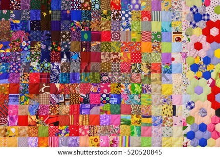 Patchwork quilt. Part of patchwork quilt as background. Flower print. Color blanket in style patchwork. Color blanket. Handmade.