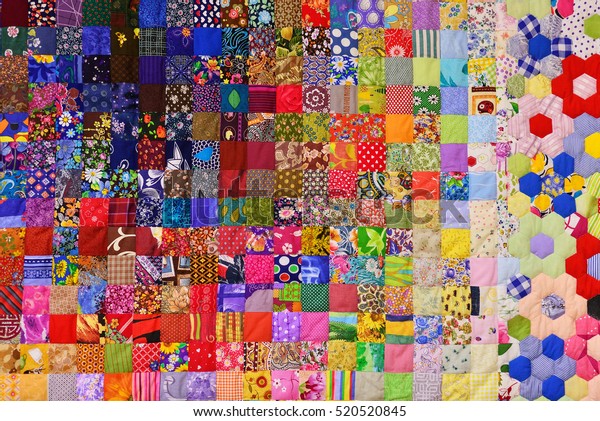 Patchwork quilt. Part of patchwork quilt as\
background. Flower print. Color blanket in style patchwork. Color\
blanket. Handmade.