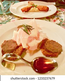 Pate Crostini With Goose Liver, Lard And A Curved Spoon Of Honey.