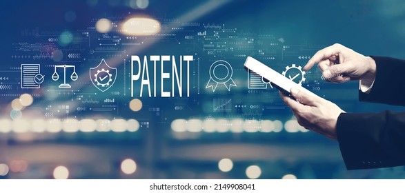 Patent concept with businessman using a tablet computer - Shutterstock ID 2149908041