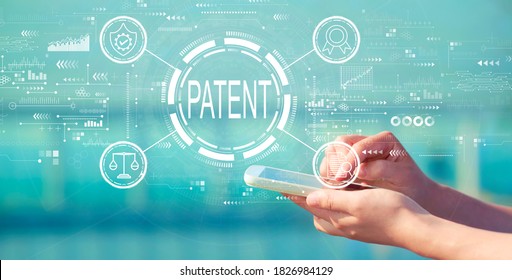 Patent concept with person holding a white smartphone - Shutterstock ID 1826984129
