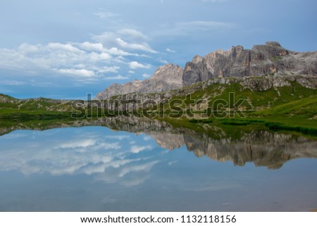 Paterno mountain reflected in smooth surface water of Laghi dei Piani - Lakes Piano, Southern Tyrol, Dolomites, Tre Cime di Lavaredo National Park, Italy