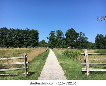 A Path Between Old Wooden Fences At Sagamore Hill In Oyster Bay, NY