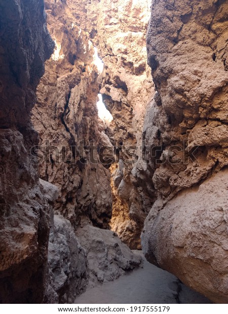Path between rock formations\
to the salt caves at Moon Valley (Valle de la Luna), Atacama,\
Chile. 