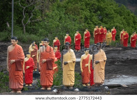 Path to Enlightenment: A Long Row of Monks Statues in a Sacred Sri Lankan
