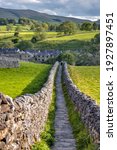 The path from Grassington to Linton falls in the Yorkshire dales national park. Iconic Yorkshire dry stone walls