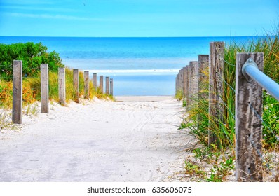 Path Leading Down To The Beach On Sunny Summer Day.