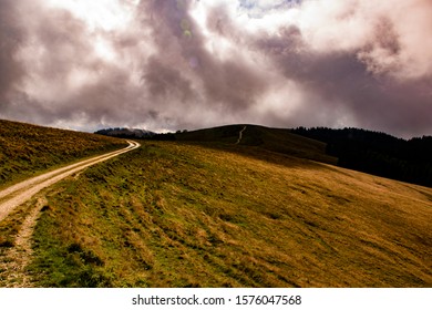 path meanders through the fields on the mountains of the Asiago plateau near Vicenza, Italy.