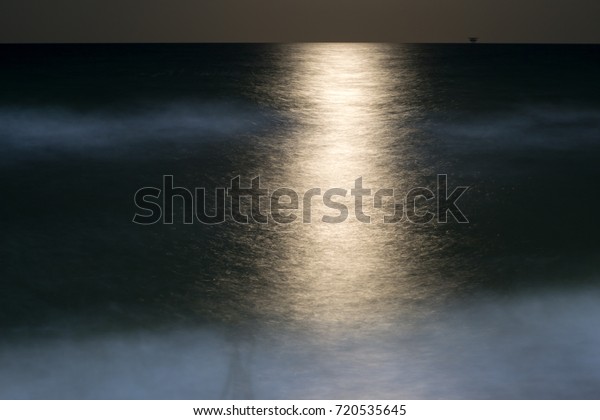 The path from moonlight\
on sea water