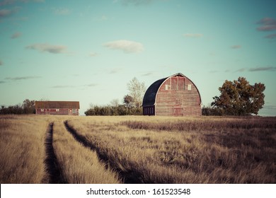 Path to the old red barn on a farm