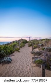 Path in the sand leading down to the ocean