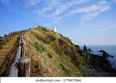 a path to a seaside lighthouse