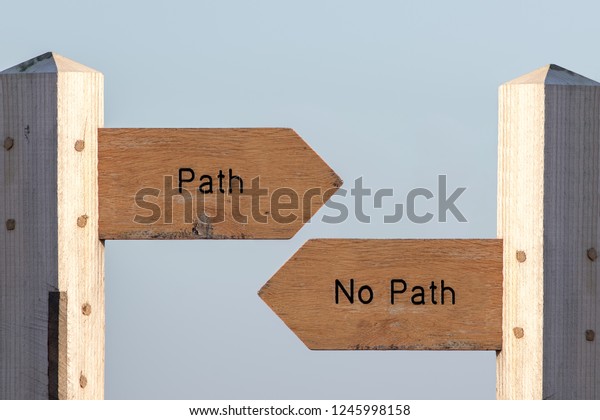 Path sign choice. Follow destiny or make your own\
way through life. Debating spirituality, determinism and\
expectations. Choose an easy planned life or simply follow your\
heart. Ramblers sign post.