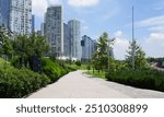 Path surrounded by nature in Parque Urbano la Mexicana Mexico City, surrounded by skyscrapers and rosemary bushes